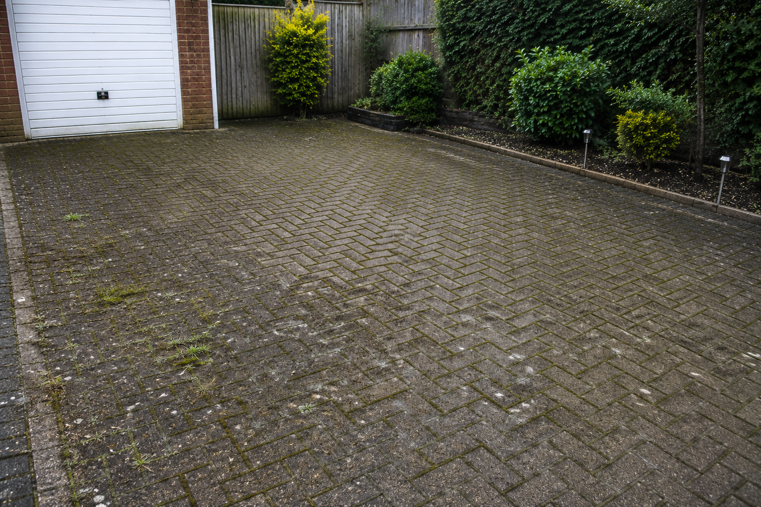 Driveway before pressure washing